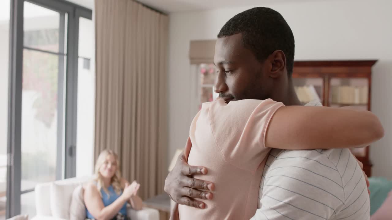 Diverse friends talking and embracing at group therapy, slow motion