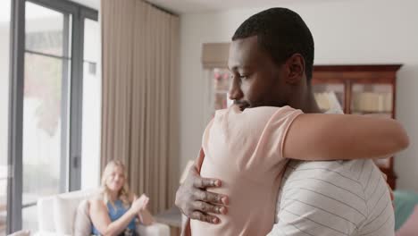 diverse friends talking and embracing at group therapy, slow motion