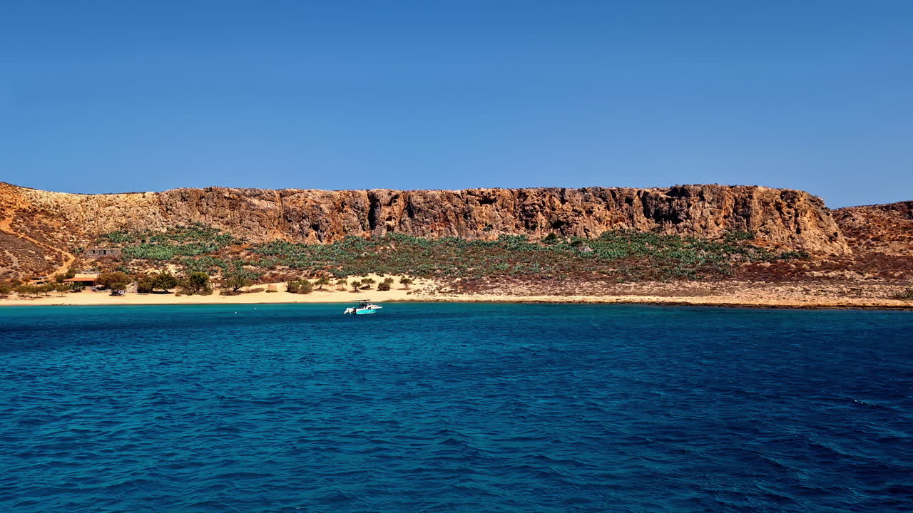 Secluded Beach with Turquoise Water and Rocky Cliffs