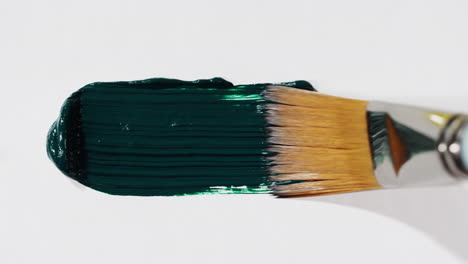 close-up of green paint on a brush