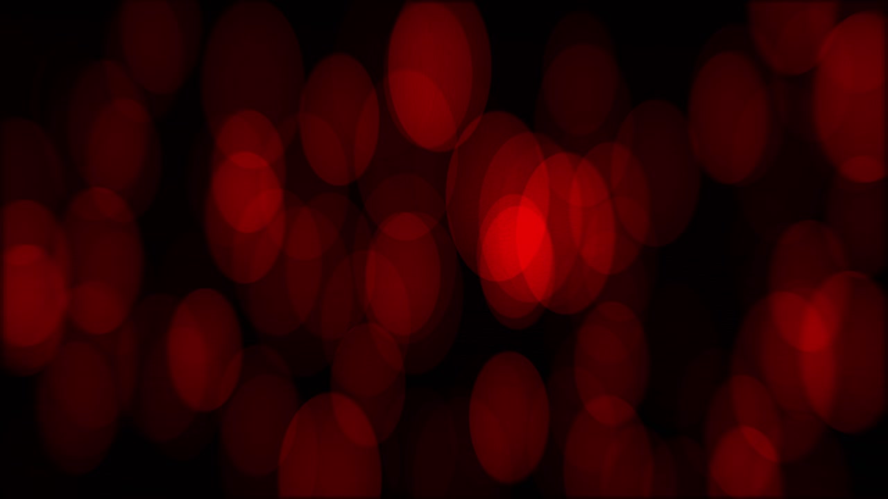 animación de bokeh con aumento de los círculos rojos en altura y sutil deriva horizontal