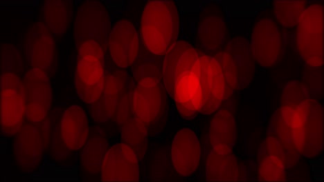 animación de bokeh con aumento de los círculos rojos en altura y sutil deriva horizontal