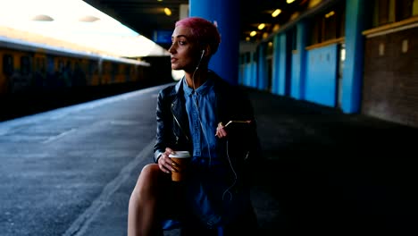 pink hair woman listening music on mobile phone 4k