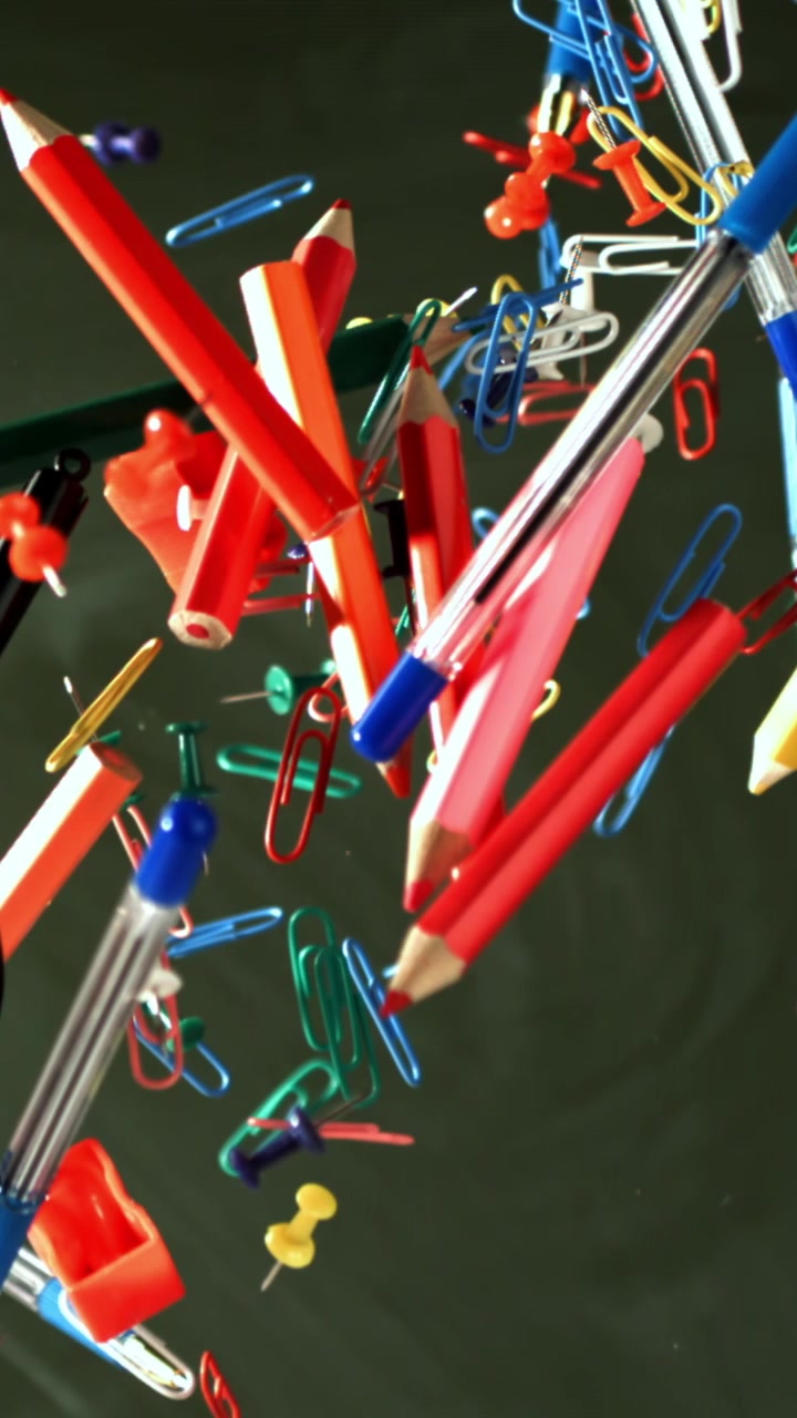 Slow Motion Fall of Colorful School and Office Supplies
