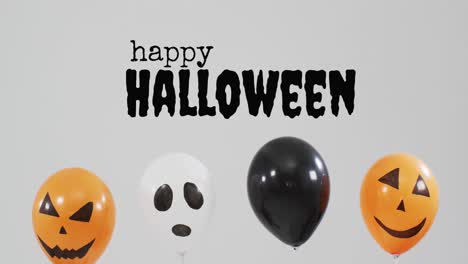 Happy-halloween-text-banner-over-halloween-pumpkin-printed-balloons-against-grey-background