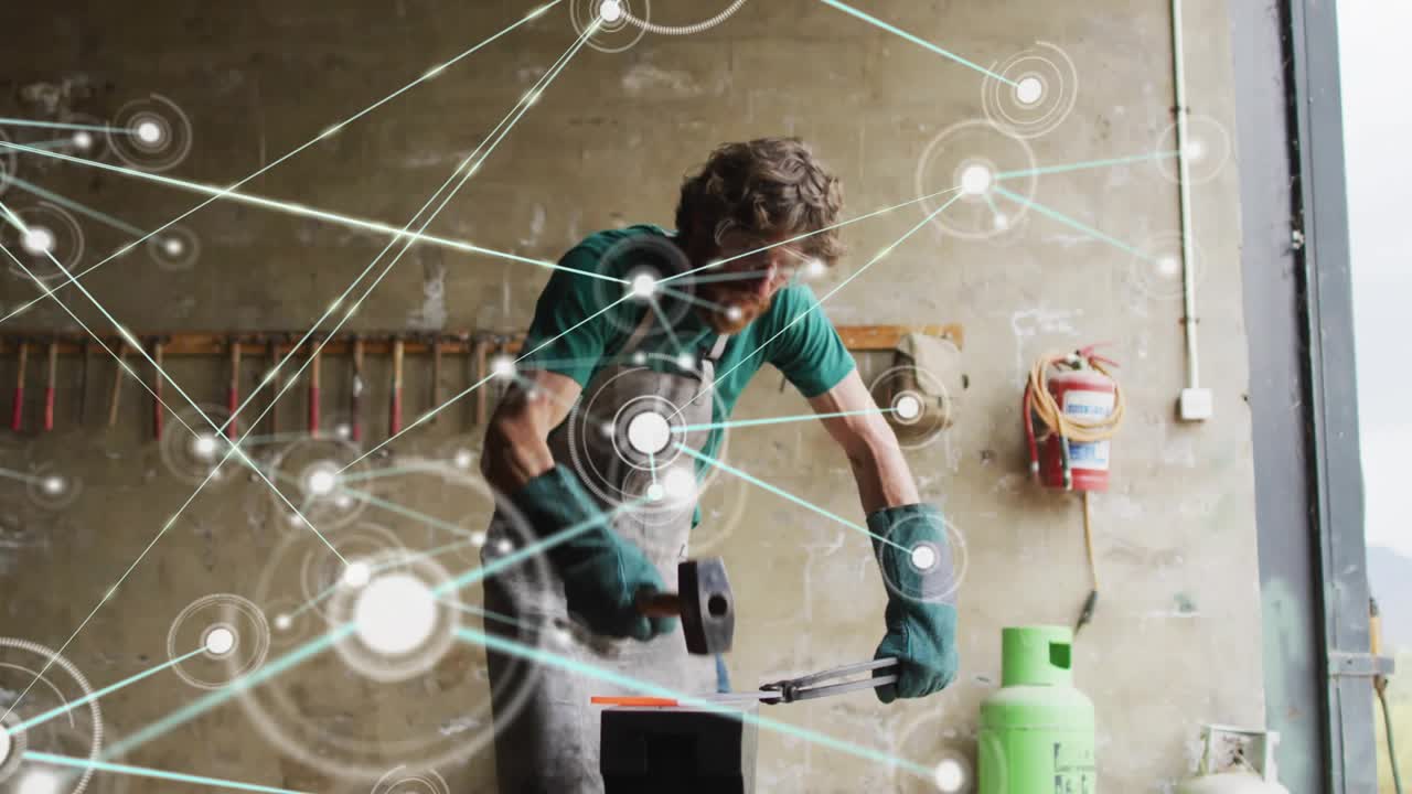 Gripping red-hot metal and raising hammer, blacksmith forging metal as network graphic expands