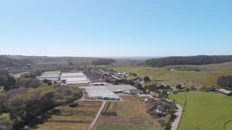 slow drone fly over of agriculture goat farms and the pacific coast near half moon bay california
