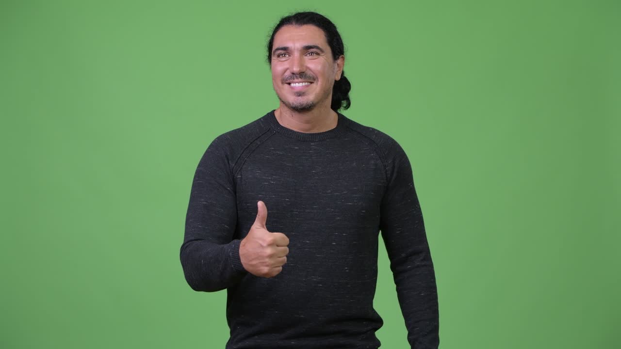 Handsome man giving thumbs up