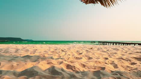 Summer-scenery-of-a-white-sand-beach-and-tropical-blue-sea-and-sky-at-Soksan-Beach-in-Koh-Rong-Island,-Cambodia