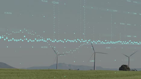 Animation-of-data-processing-over-spinning-windmills-on-grassland-against-grey-sky