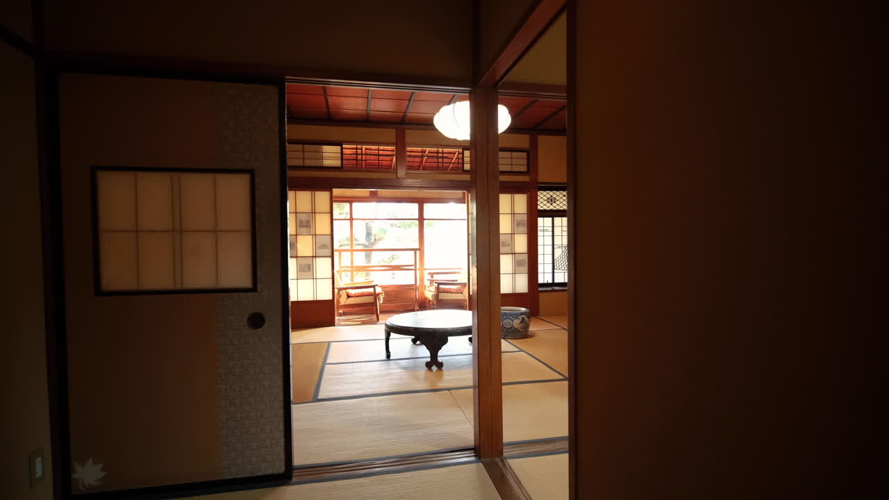 Classic Japanese residential street with white walls and dark wood