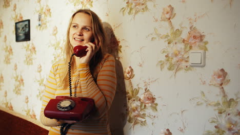happy young woman receving a call at home