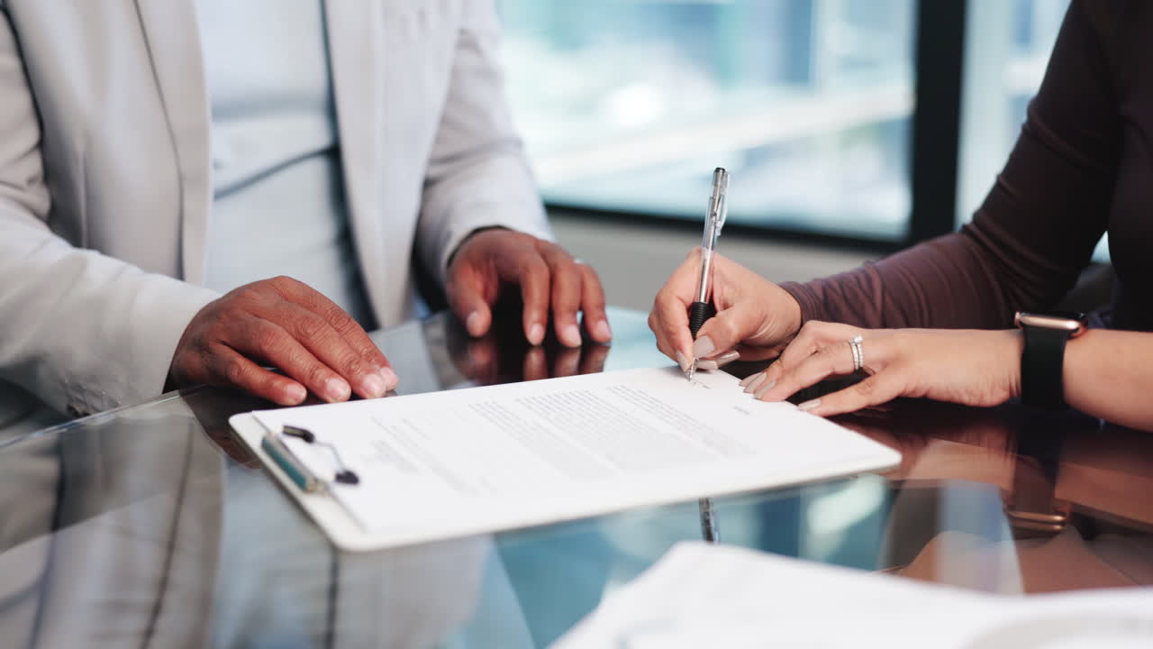 Close Up of Hands Signing a Business Contract
