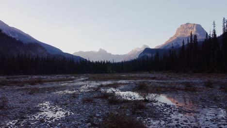 Mountains-in-forest-puddles-of-water-dry-river-bed-pan