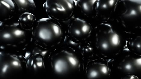 abstract black squishy balls move and interact with each other with internal pressure trying to find a place for themselves.