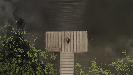 above beautiful woman flutter dress on wooden path