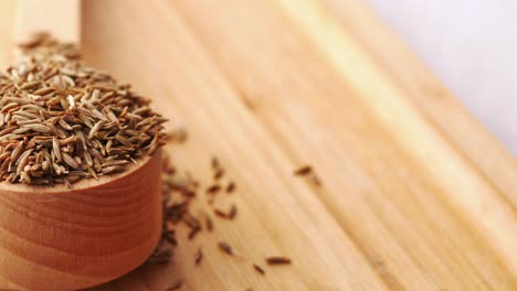 cumin seeds on spoon on table