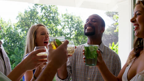 group of friends toasting drink glasses