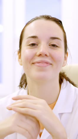 female doctor typing using computer in a clinic room
