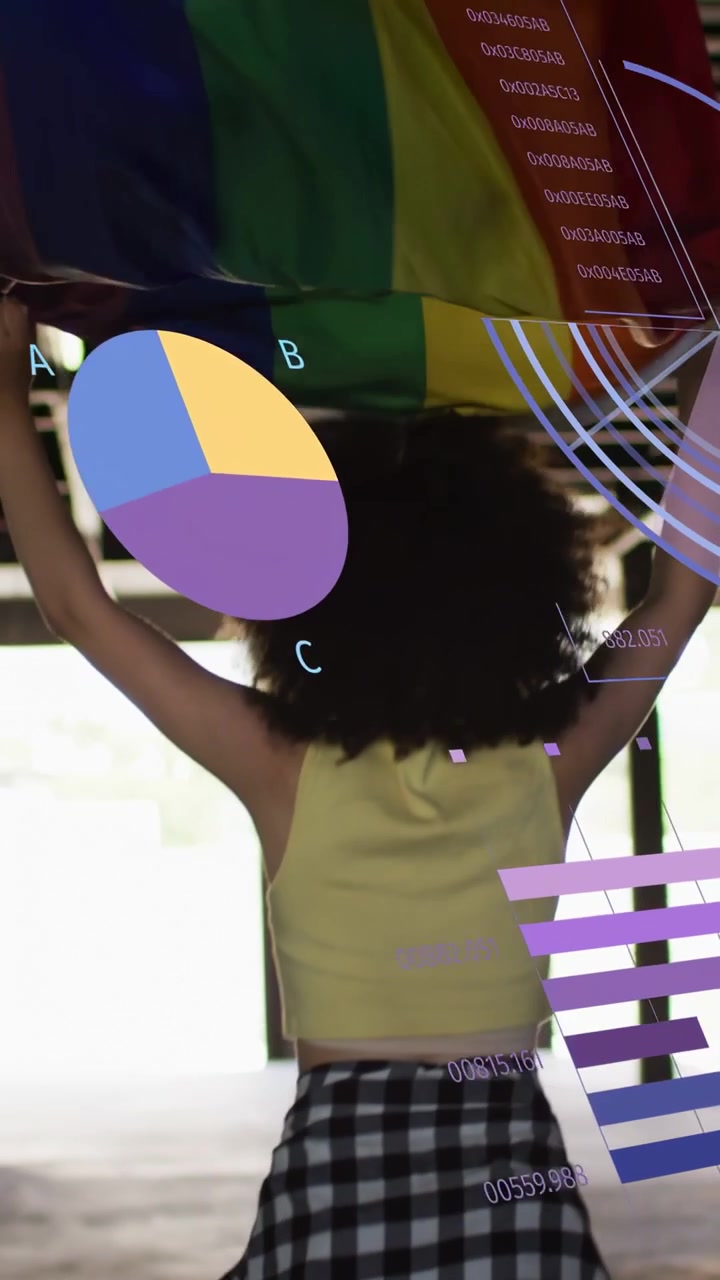 Vertical video: Woman waving pride flag in garage, flag movement causing charts over flag for tech