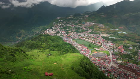 ham rong or dragon’s jaw mountain and sapa town, vietnam. aerial drone panoramic view