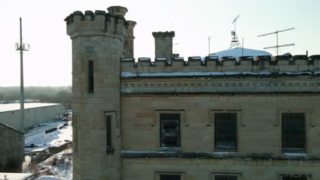 Sun-peaking-betwen-tower-of-old-joliet-prison-illinois,-USA-famous-for-prison-break-tv-series-and-blues-brothers