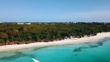 1 million $ aerial flight crane drone shot of a pirate sailing boot with white sail on crystal clear turquoise water paradise dream beach zanzibar, africa 2019