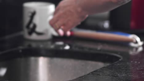 slow motion washing dishes