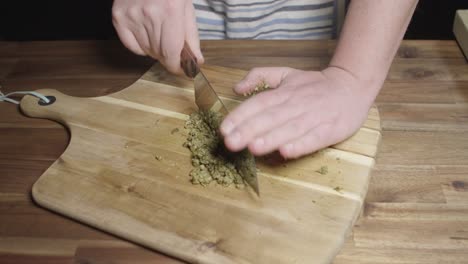 finely chopping spices to prepare cafe de paris butter, perfect sauce for meats