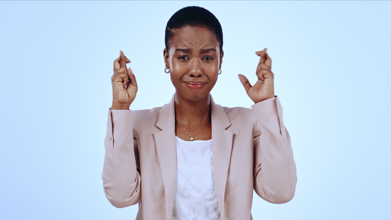 Portrait of nervous black woman in studio
