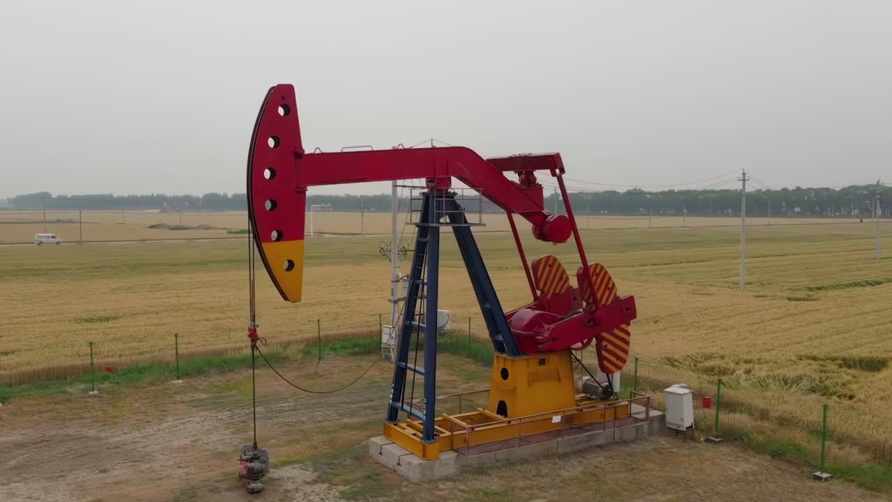 Natural crude Oil pump jack, oil industry equipment, drilling derricks silhouette from field at sunset. The latest fossil resources of the planet. Saving and limiting consumption