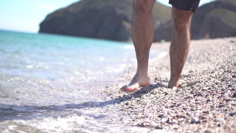 seashore, coastline, scenic view of people at unspoiled beach in almeria, called playa de los muertos, in english the beach of deads due to the strong currents that cause many deaths year after year