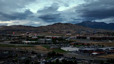Twilight-over-an-idyllic-community-in-the-foothills-of-the-mountains---aerial-parallax-panorama