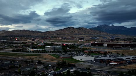 twilight over an idyllic community in the foothills of the mountains - aerial parallax panorama