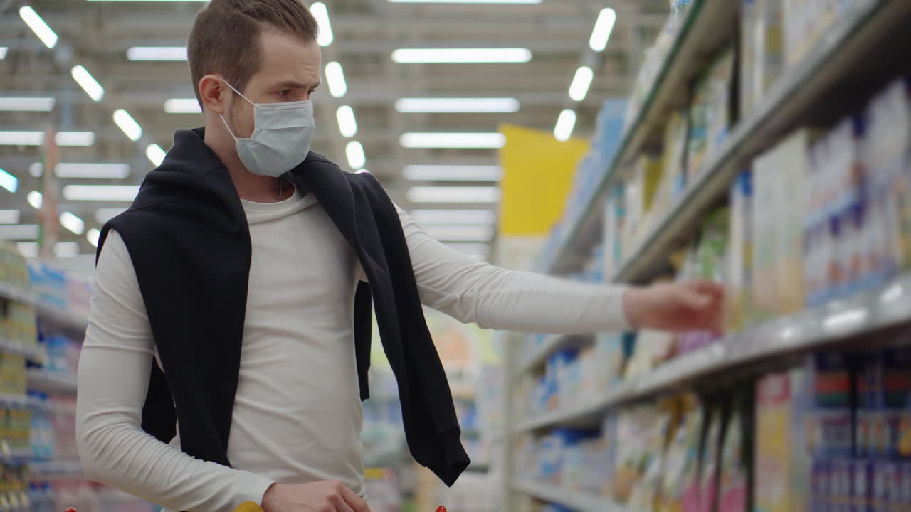 Man Shopping at Grocery Store Wearing a Mask