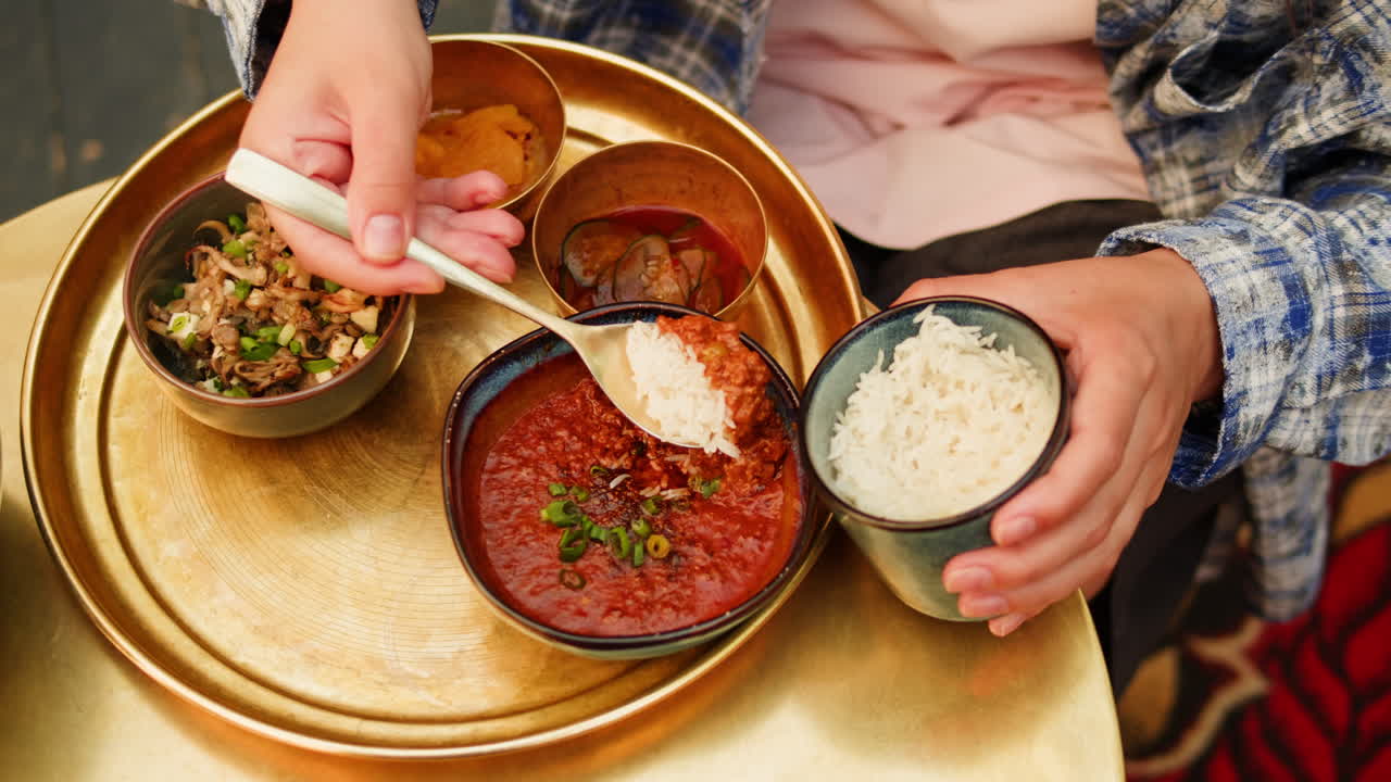 Person eating Korean food