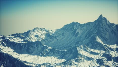 aerial view of the alps mountains in snow