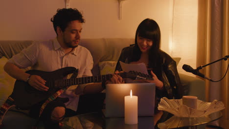 musicians songwriting at home
