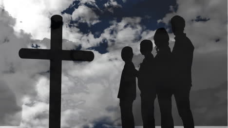 animación de la silueta de la cruz cristiana y una silueta de una familia de cuatro