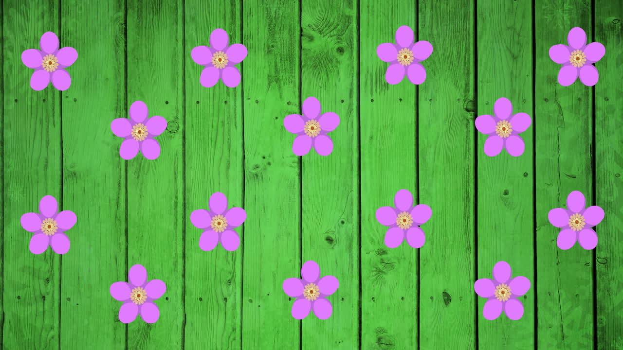 animación de flores púrpuras girando sobre un fondo verde