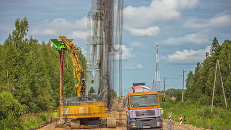 Shot-of-engineers-checking-petrochemical-gas-pipeline-along-rural-pathway-surrounded-by-green-vegetation-at-daytime