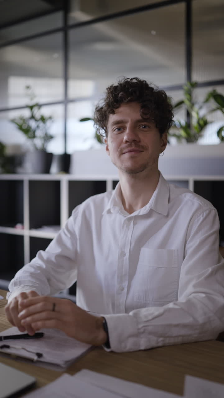 Man Sitting at His Desk in Modern Office