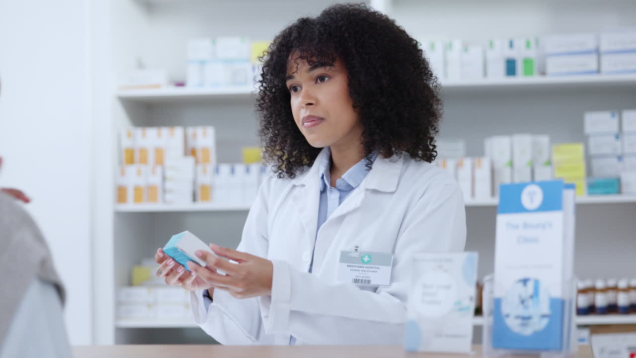 Friendly pharmacist helping patient