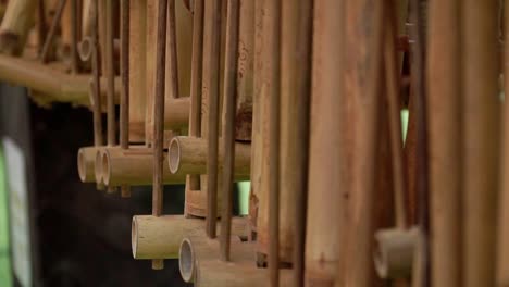 angklung musical instruments are hung in a row