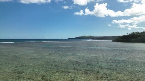 Aerial-Dolly-flying-low-over-the-shallow-waters-at-Anini-Beach,-Kauai-Hawaii