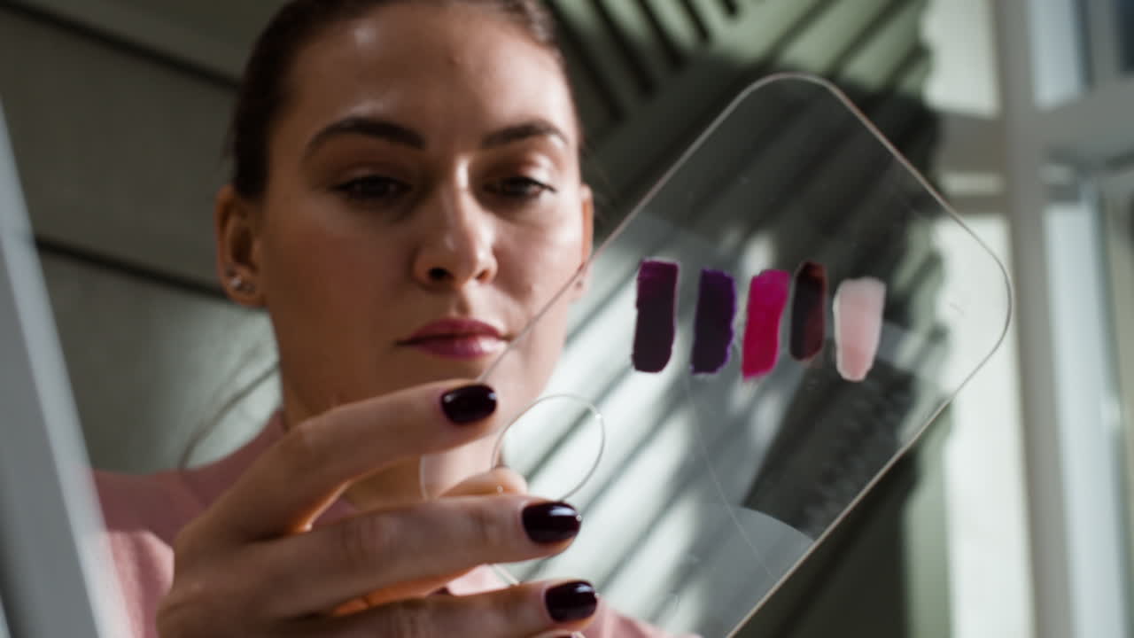 Woman examining nail polish color swatches