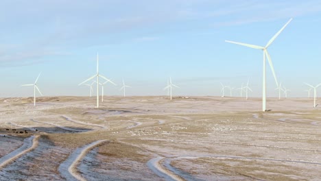 Aerial-shots-of-wind-turbines-on-a-cold-winter-afternoon-in-Calhan,-Colorado