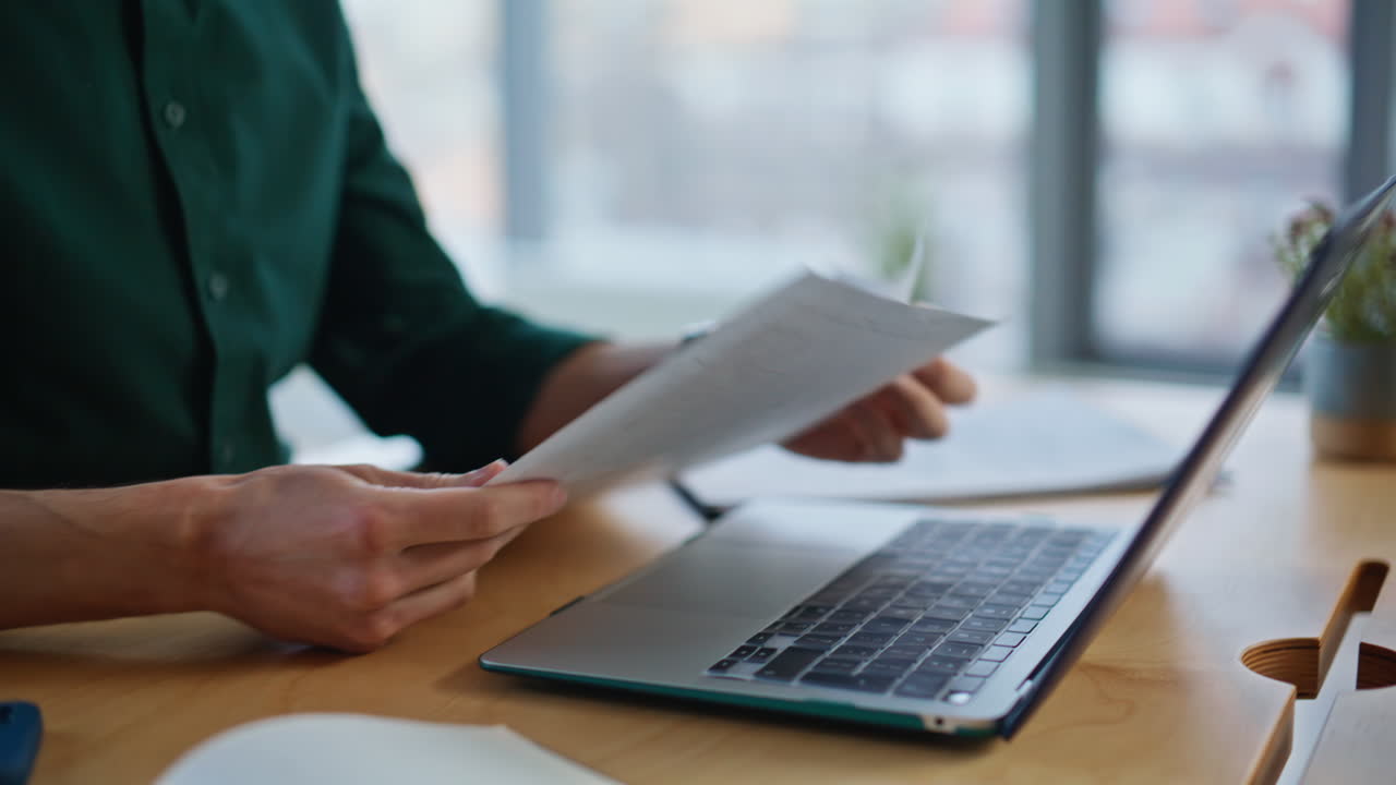 Accountant hands checking documents at investment company workplace closeup