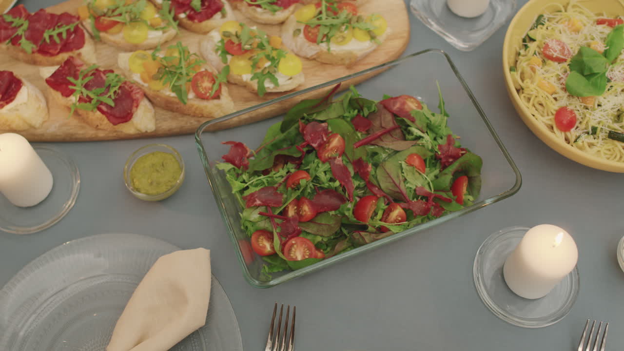 Serving Roast Beef Salad On Family Dinner Table