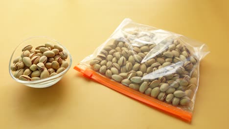 pistachios in a plastic bag and bowl